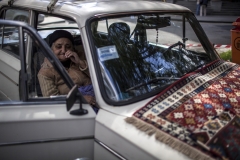 A woman sells rugs in the corner of the street. She says " I'm not the one who has to sidestep my job, politicians must do this !!". April 22, 2018, Yerevan-Armenia.