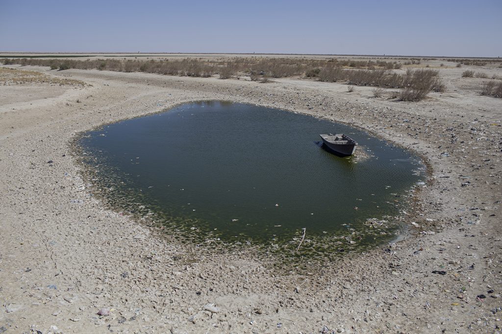 A view of the remain part of Hamoun lake in Hirmand city near Afghanistan border, Sistan & Baluchistan province, Iran. Hamoun Lake is located in Sistan and Baluchestan province (Zabol County) in the adjacent border of Afghanistan, is irrigated mainly by the Helmand River. The International Hamoun Lake and its marvelous natural environment are some of the most valuable natural assets of Iran. The lake was registered as a unique natural reserve (biosphere reserve) by UNESCO at the 4th World Congress of Biosphere Reserve, held in 2015 in Lima, Peru.
